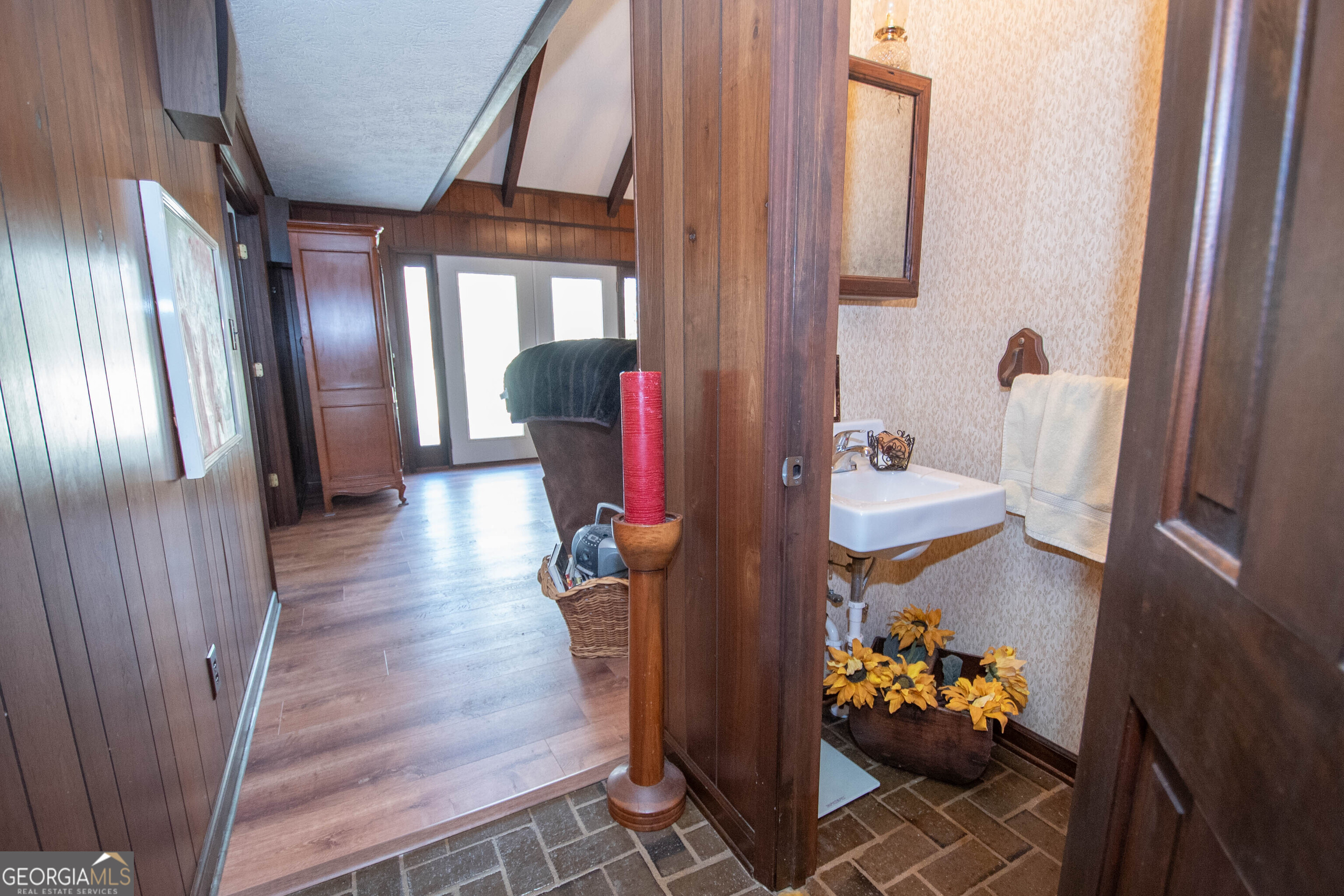 151 Evans Road Milner, GA 30257 - Photo 47 of 60 a hallway with dining room and wooden floor