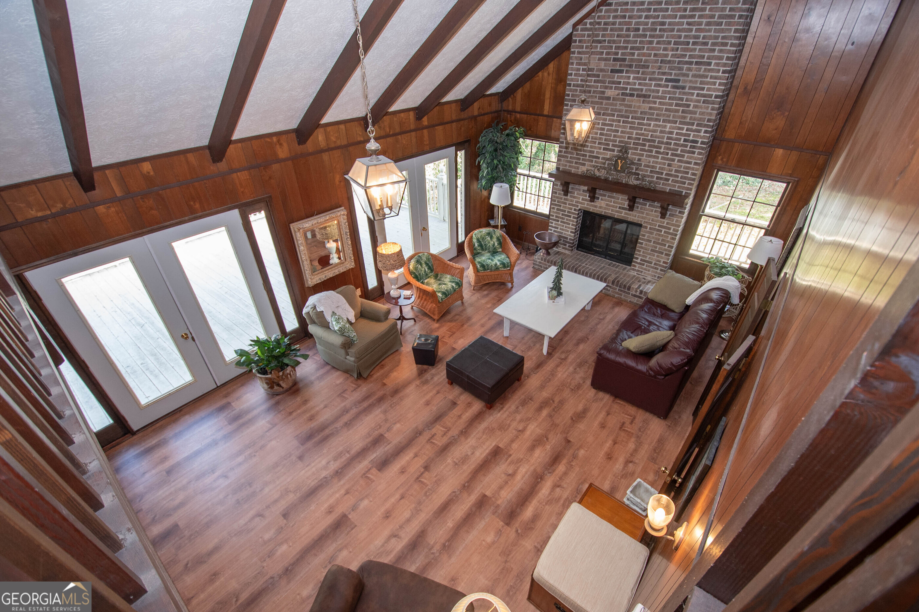 151 Evans Road Milner, GA 30257 - Photo 49 of 60 a living room with furniture floor to ceiling window and wooden floor