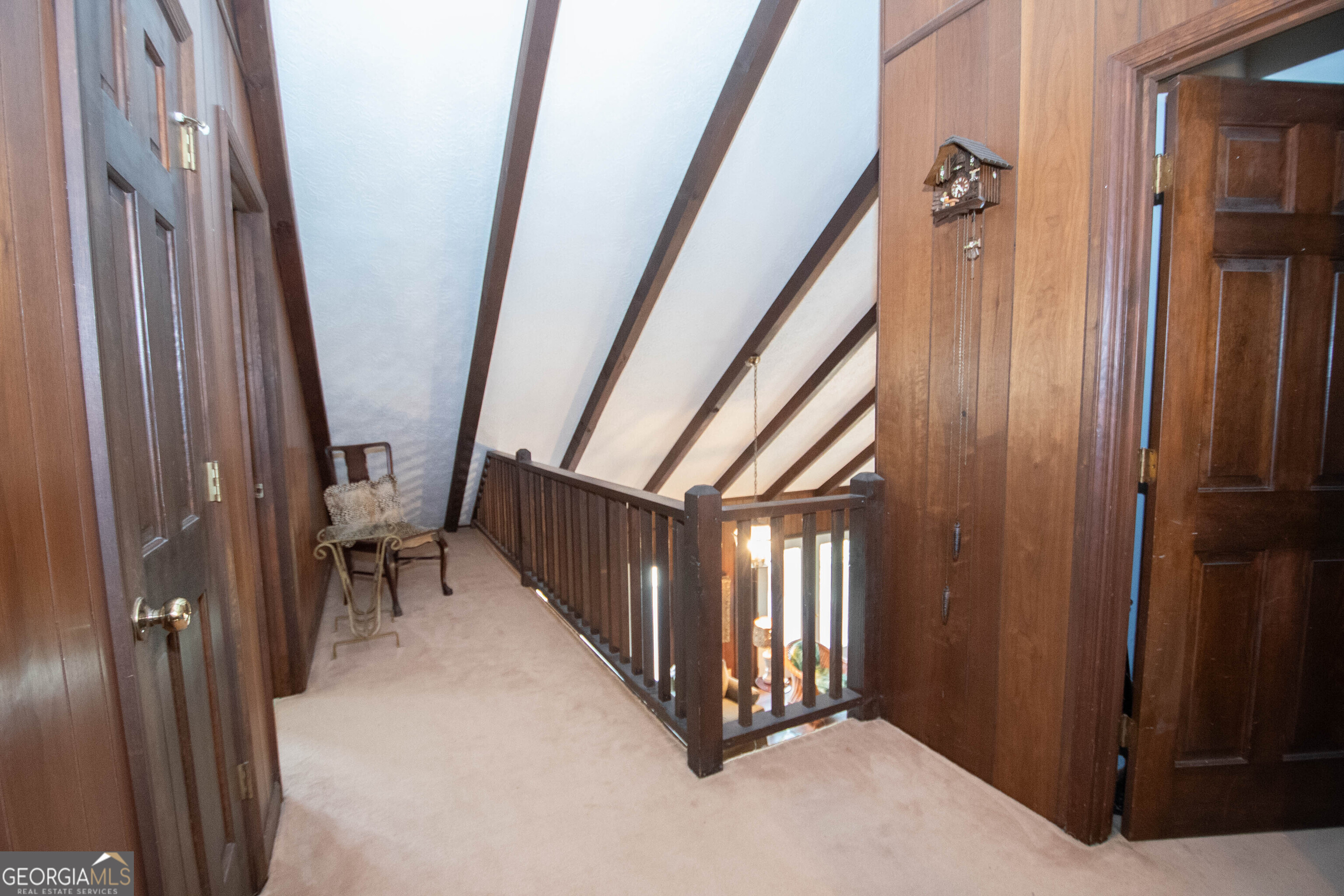 151 Evans Road Milner, GA 30257 - Photo 50 of 60 a view of a hallway with wooden floor and staircase