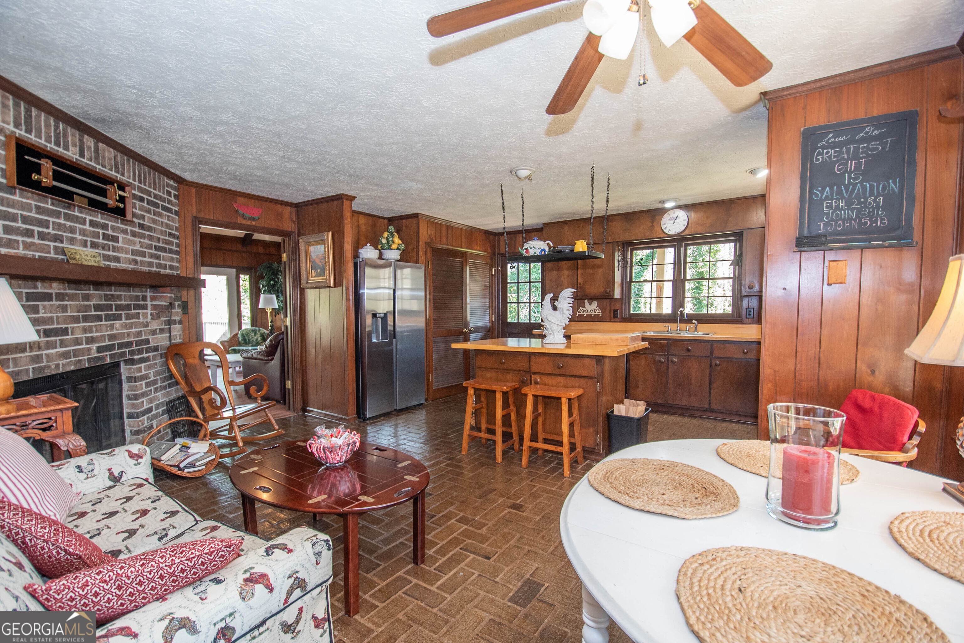 151 Evans Road Milner, GA 30257 - Photo 9 of 60 a dining room with furniture a rug and wooden floor