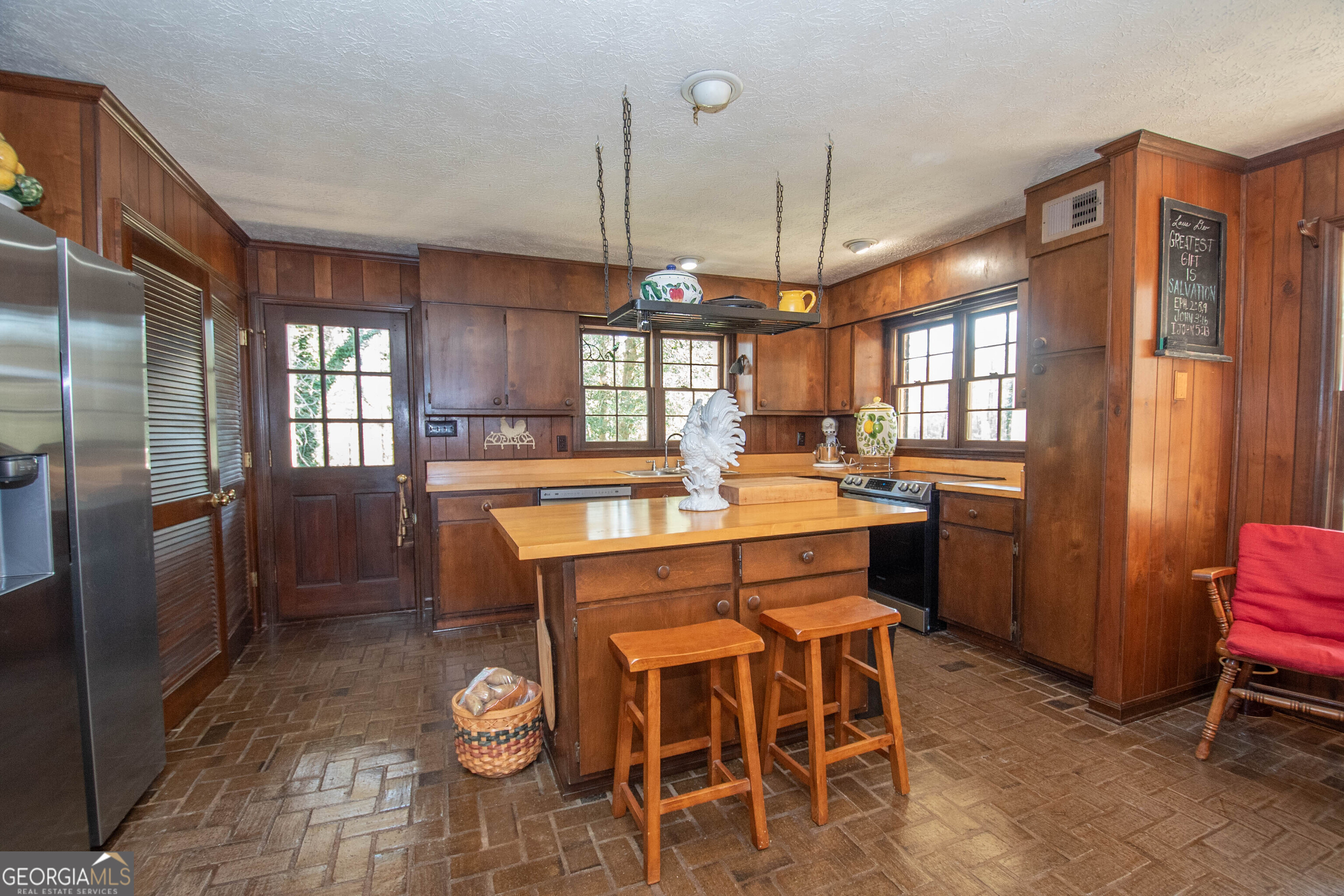 151 Evans Road Milner, GA 30257 - Photo 10 of 60 a dining area with a table chairs and entryway