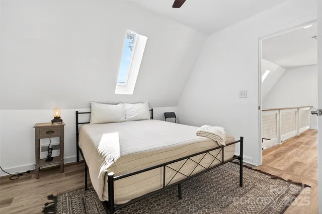 a bedroom with a bed and a table in it