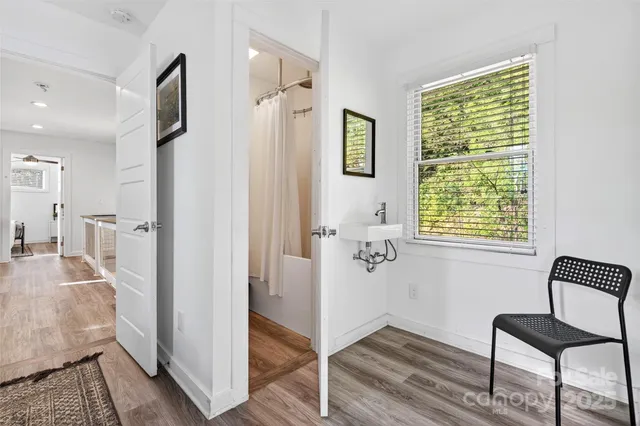 a view of a livingroom with furniture and a window