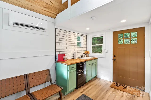 a view of workspace with furniture and window