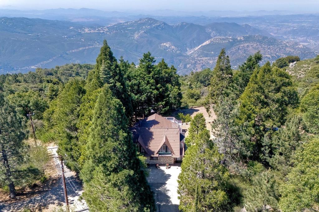 22223 Crestline Road Palomar Mountain, CA 92060 - Photo 80 of 90 an aerial view of a house with a yard and garden