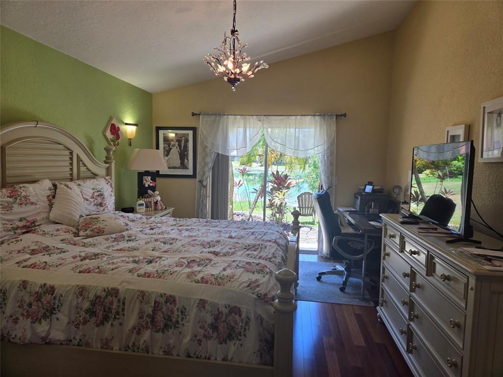 22112 Altona Drive Boca Raton, FL 33428 - Photo 13 of 40 a bedroom with a bed window and a flat screen tv