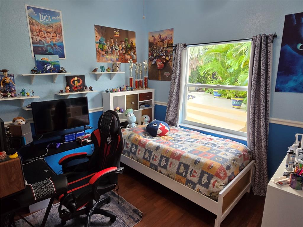 22112 Altona Drive Boca Raton, FL 33428 - Photo 18 of 40 a bedroom with bed and a window