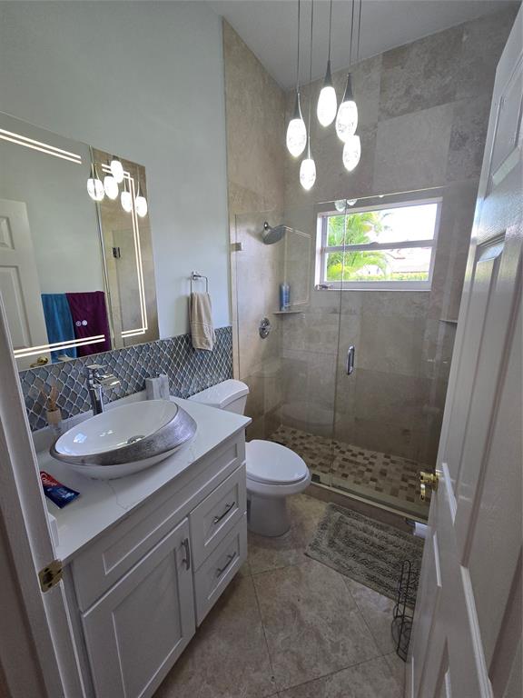 22112 Altona Drive Boca Raton, FL 33428 - Photo 20 of 40 a bathroom with a sink and a mirror