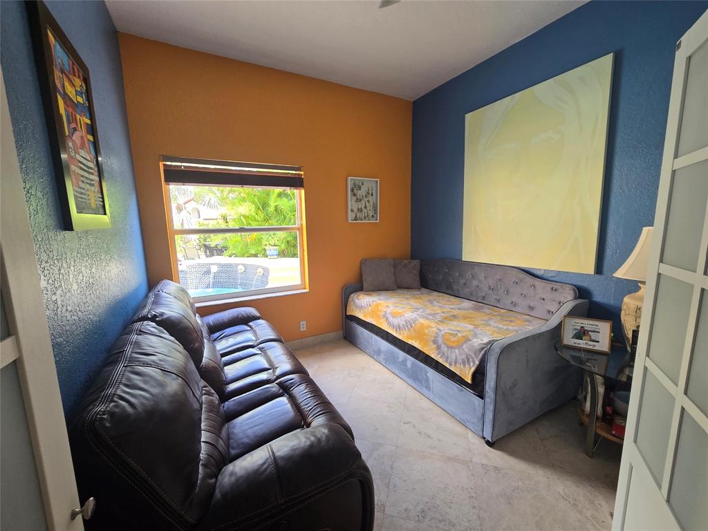22112 Altona Drive Boca Raton, FL 33428 - Photo 21 of 40 a bedroom with a bed and window with couch