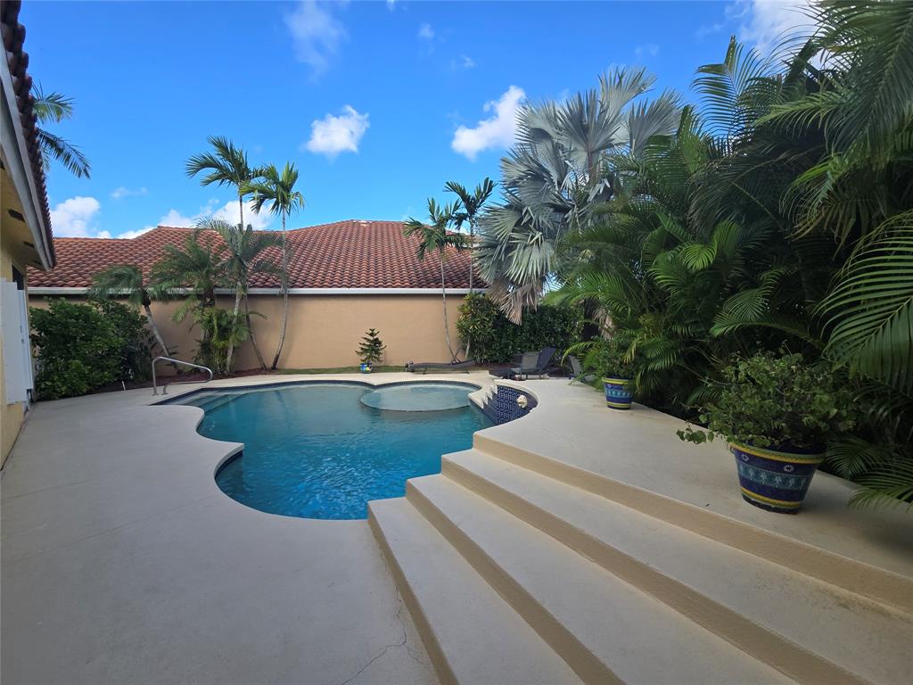 22112 Altona Drive Boca Raton, FL 33428 - Photo 26 of 40 a view of swimming pool with outdoor seating and plants