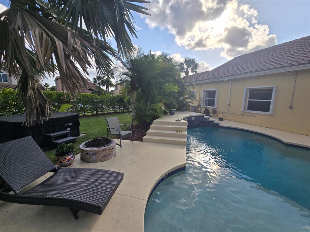 22112 Altona Drive Boca Raton, FL 33428 - Photo 30 of 40 a view of a backyard with sitting area