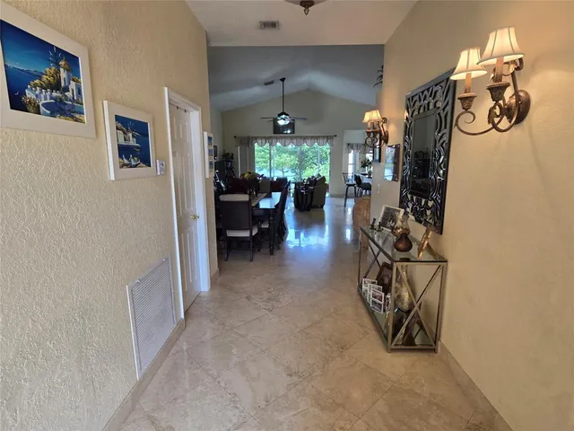 a view of a livingroom with furniture and a window
