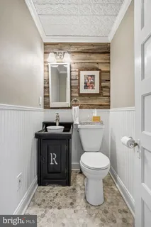 a bathroom with a toilet and a sink