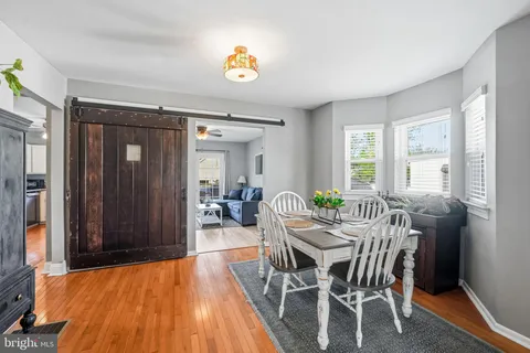 a view of a dining room with furniture and window
