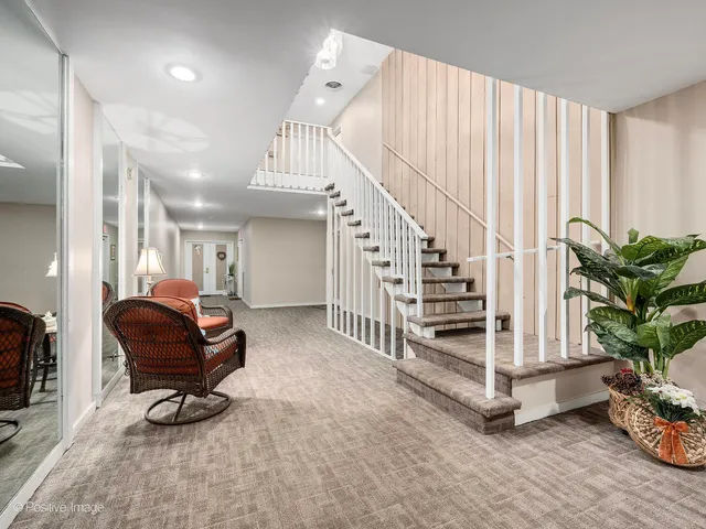 a living room with wooden floor and furniture