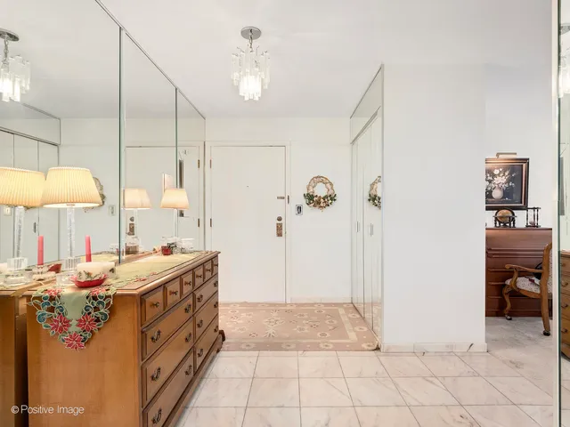 a bathroom with a double vanity sink a mirror and a shower
