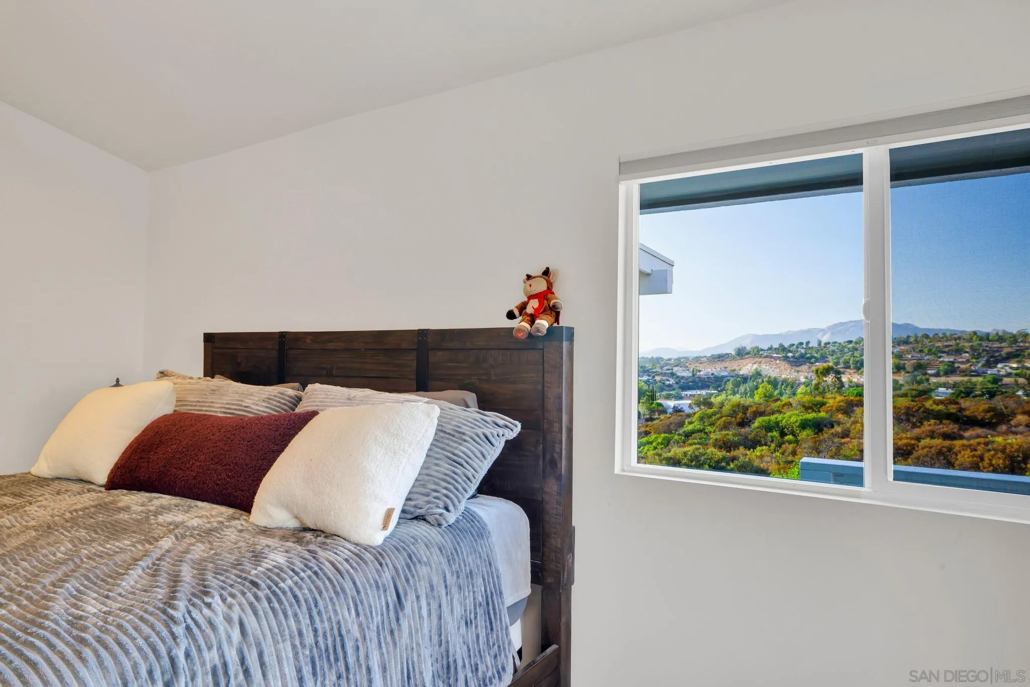 1661 West Winds Ridge Alpine, CA 91901 - Photo 22 of 65 a bedroom with a bed and a window