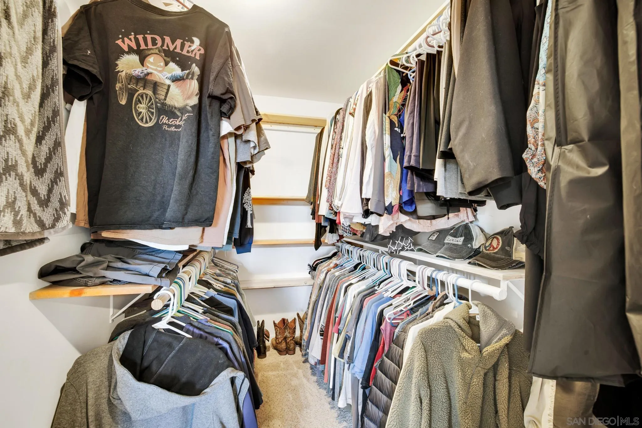1661 West Winds Ridge Alpine, CA 91901 - Photo 25 of 65 a view of walk in closet with clothes and shoes