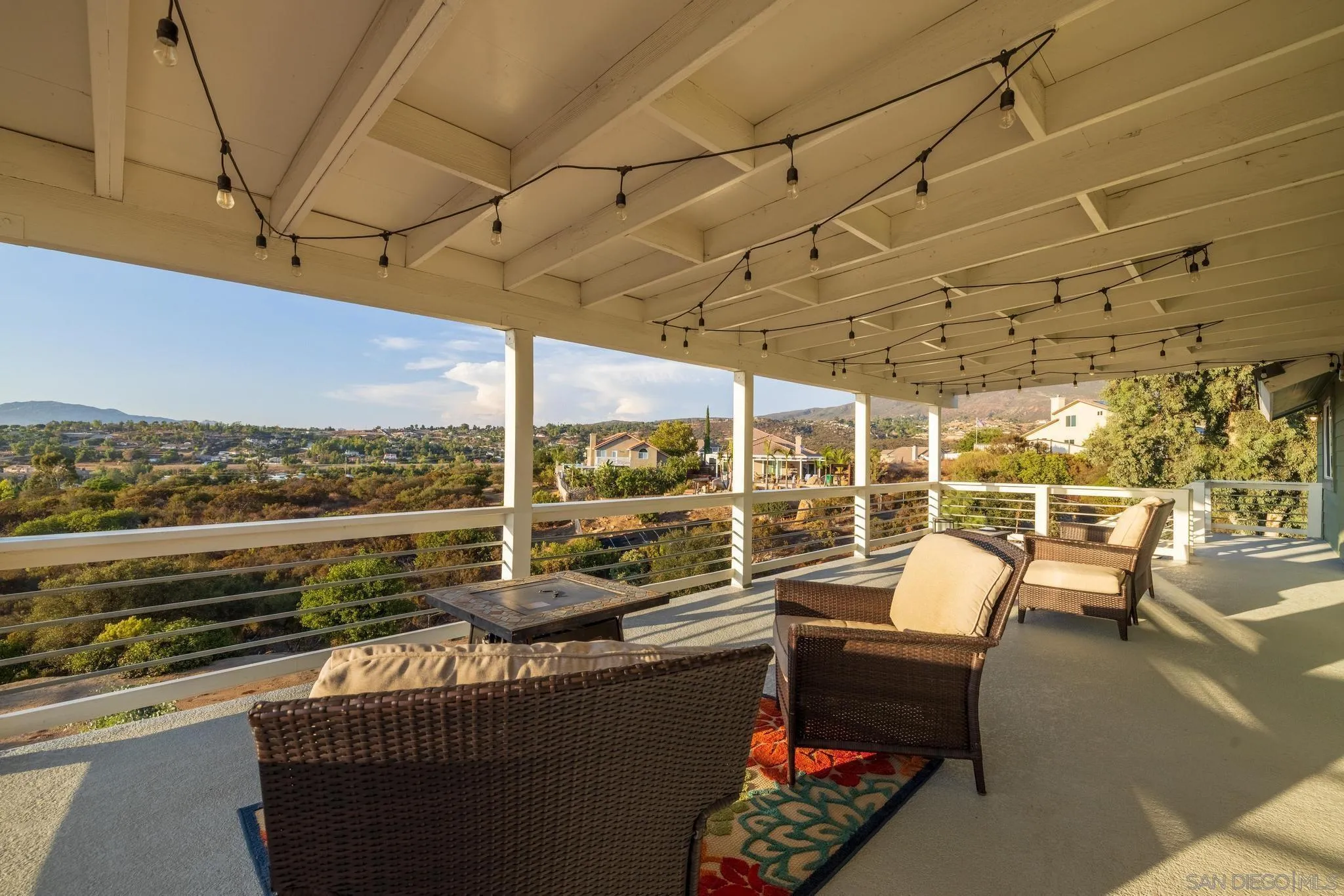 1661 West Winds Ridge Alpine, CA 91901 - Photo 38 of 65 a view of a patio with couches chairs and wooden floor