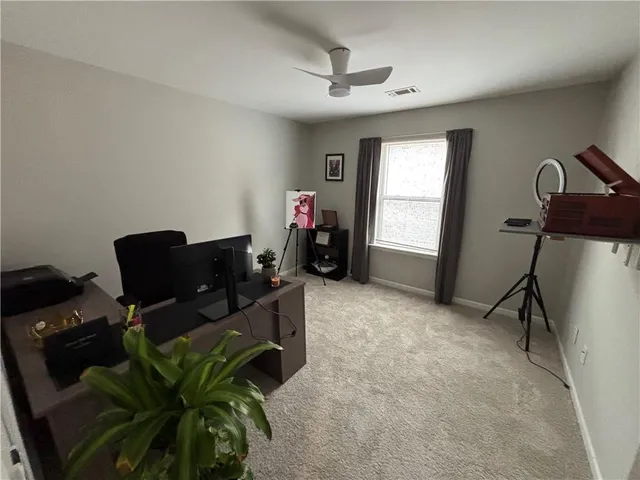 a work room with furniture and a window