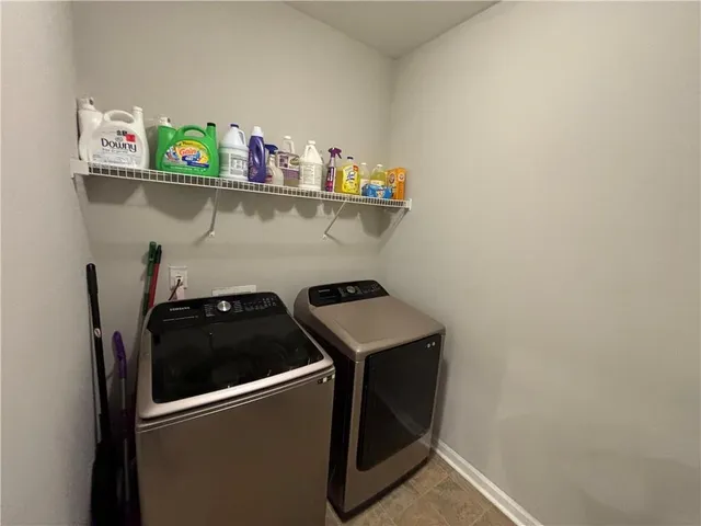 a utility room with dryer and washer