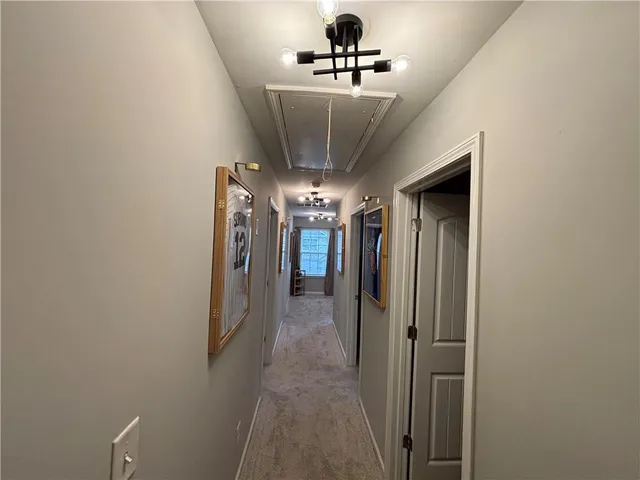 a view of a hallway with a room