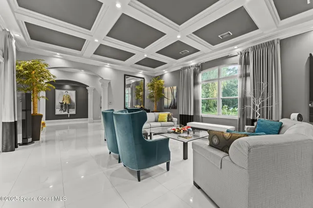 a kitchen with kitchen island granite countertop a large stove a sink a counter top space and cabinets