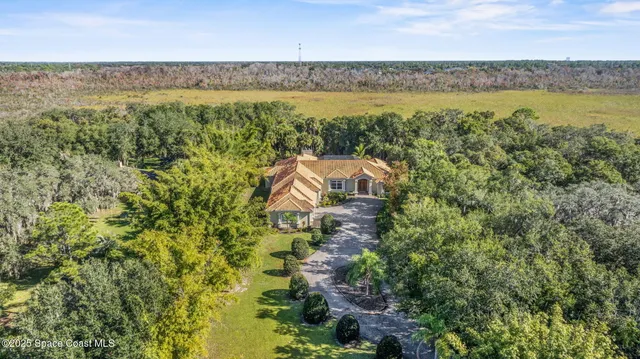 a living room with furniture a fireplace and a table