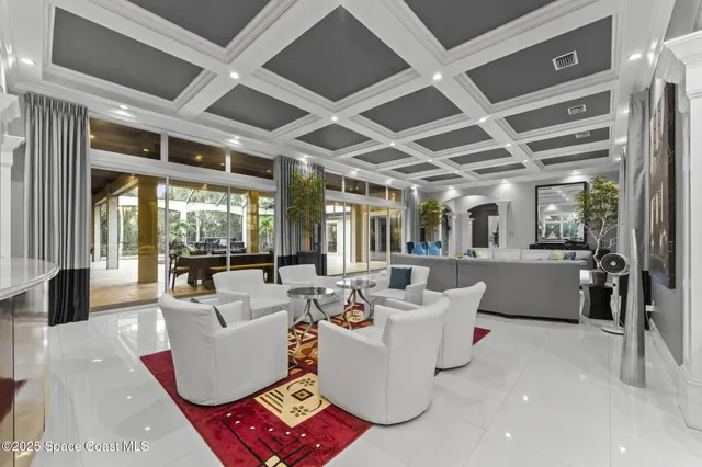 a spacious bedroom with a bed a table and chairs