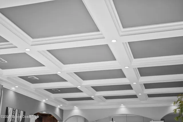 a bathroom with a granite countertop sink a mirror and a shower