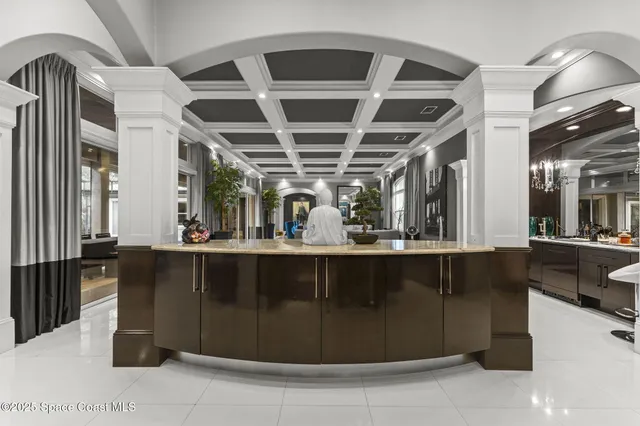 a bedroom with a bed and a large window with balcony view