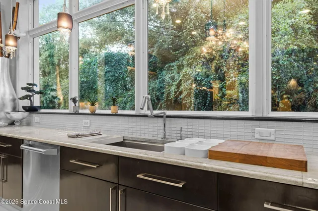 a room with lots of furniture and a large window