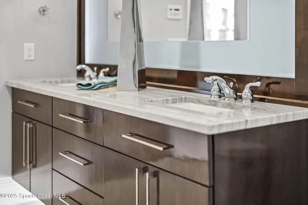 an aerial view of a house with yard and outdoor seating