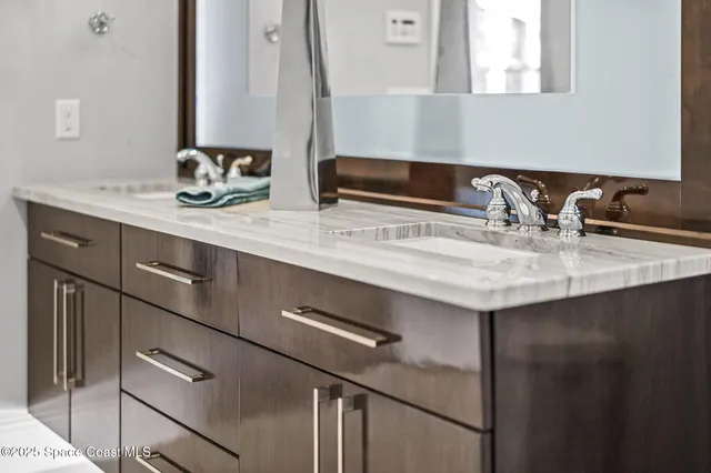 an aerial view of a house with yard and outdoor seating