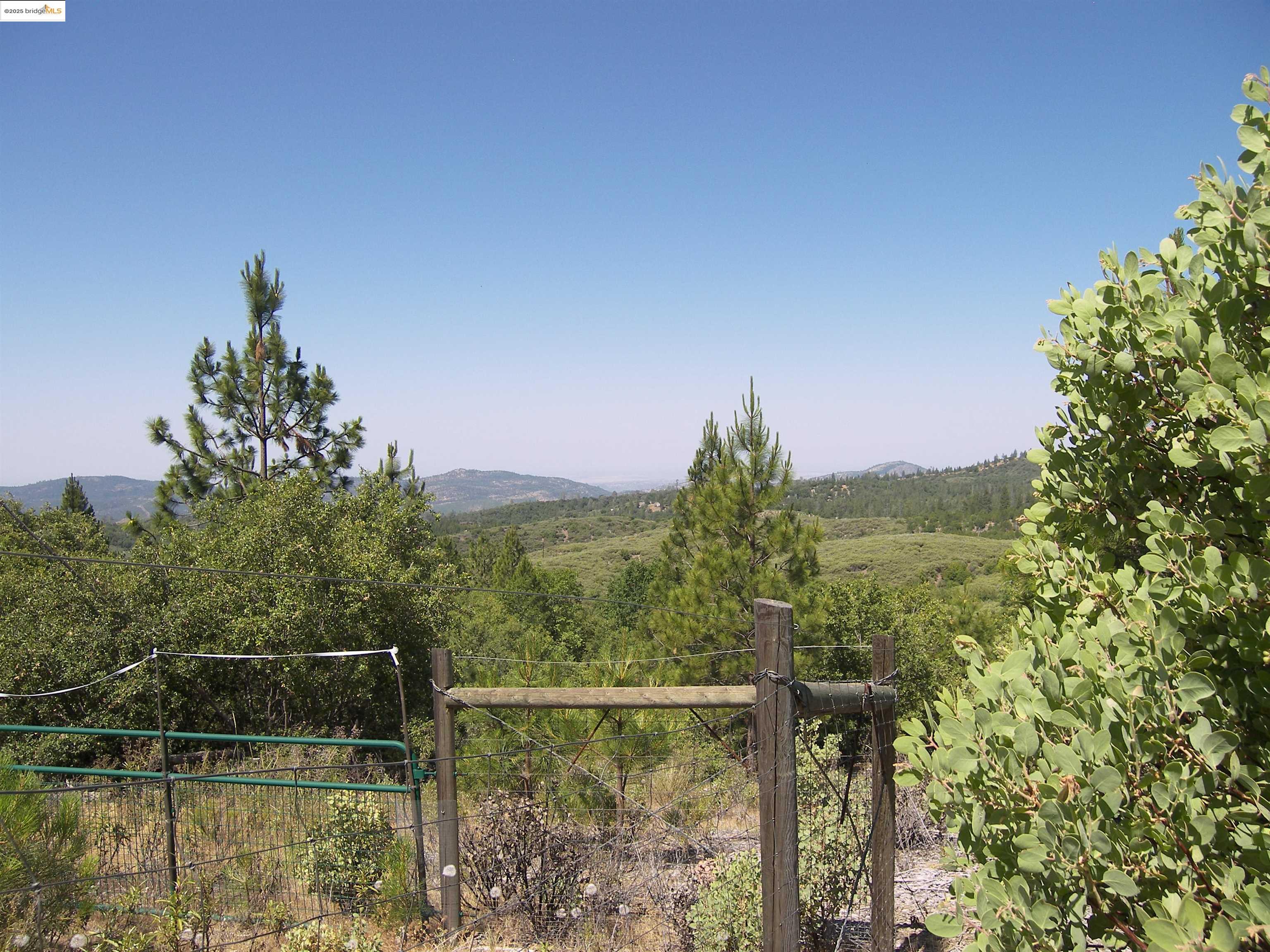 19290 Yosemite Springs Road Groveland, CA 95321 - Photo 16 of 18 a view of a lake from a balcony
