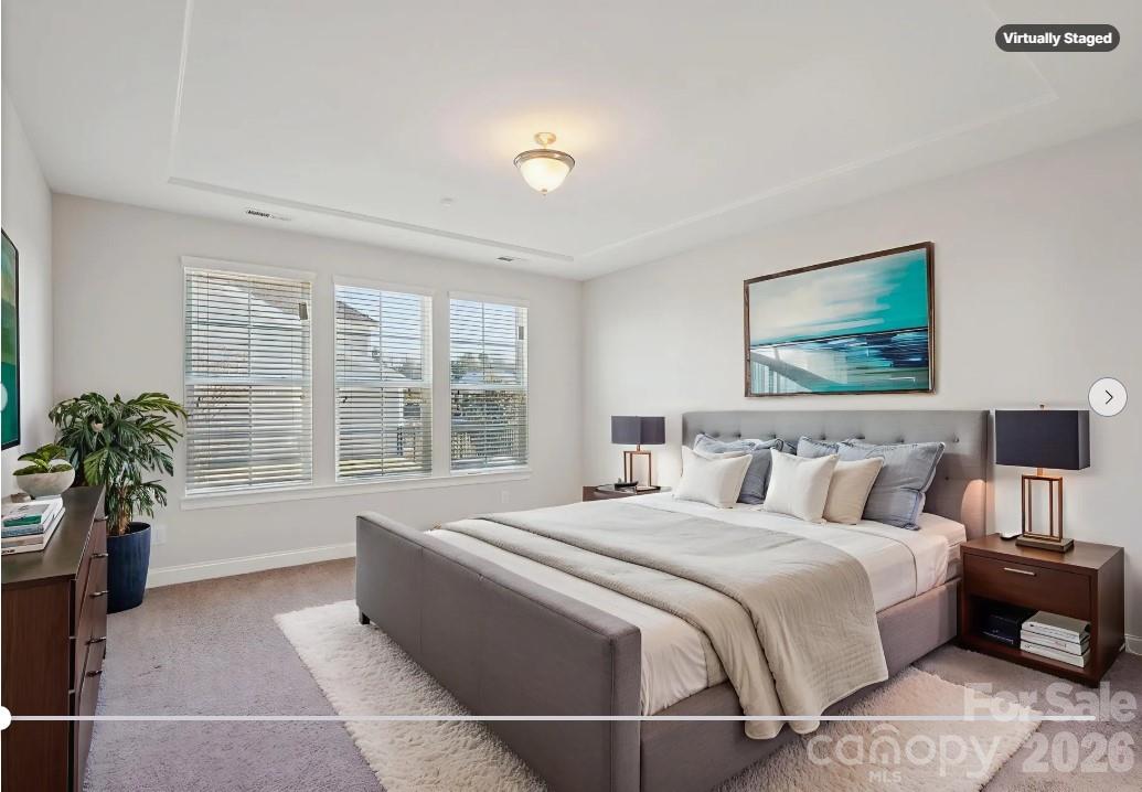 17422 Shearer Road Davidson, NC 28036 - Photo 13 of 48 a spacious bedroom with a large bed and a large window