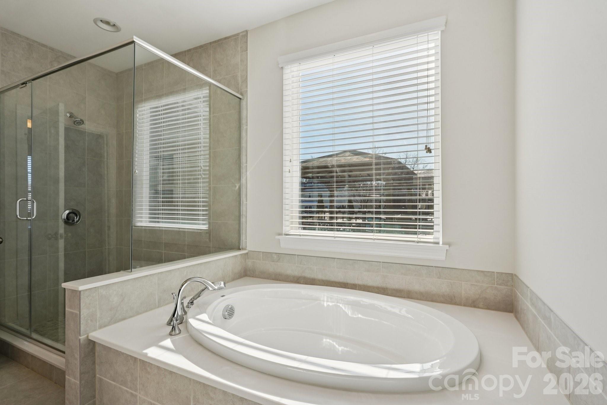 17422 Shearer Road Davidson, NC 28036 - Photo 20 of 48 a white bath tub sitting next to a window