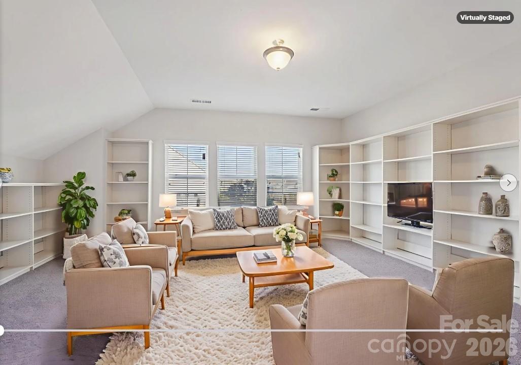17422 Shearer Road Davidson, NC 28036 - Photo 28 of 48 a living room with furniture and a fireplace