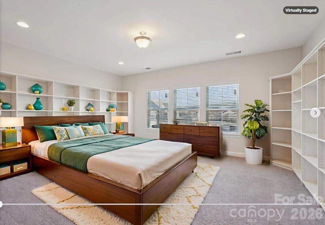 17422 Shearer Road Davidson, NC 28036 - Photo 30 of 48 a bedroom with a large bed and potted plant