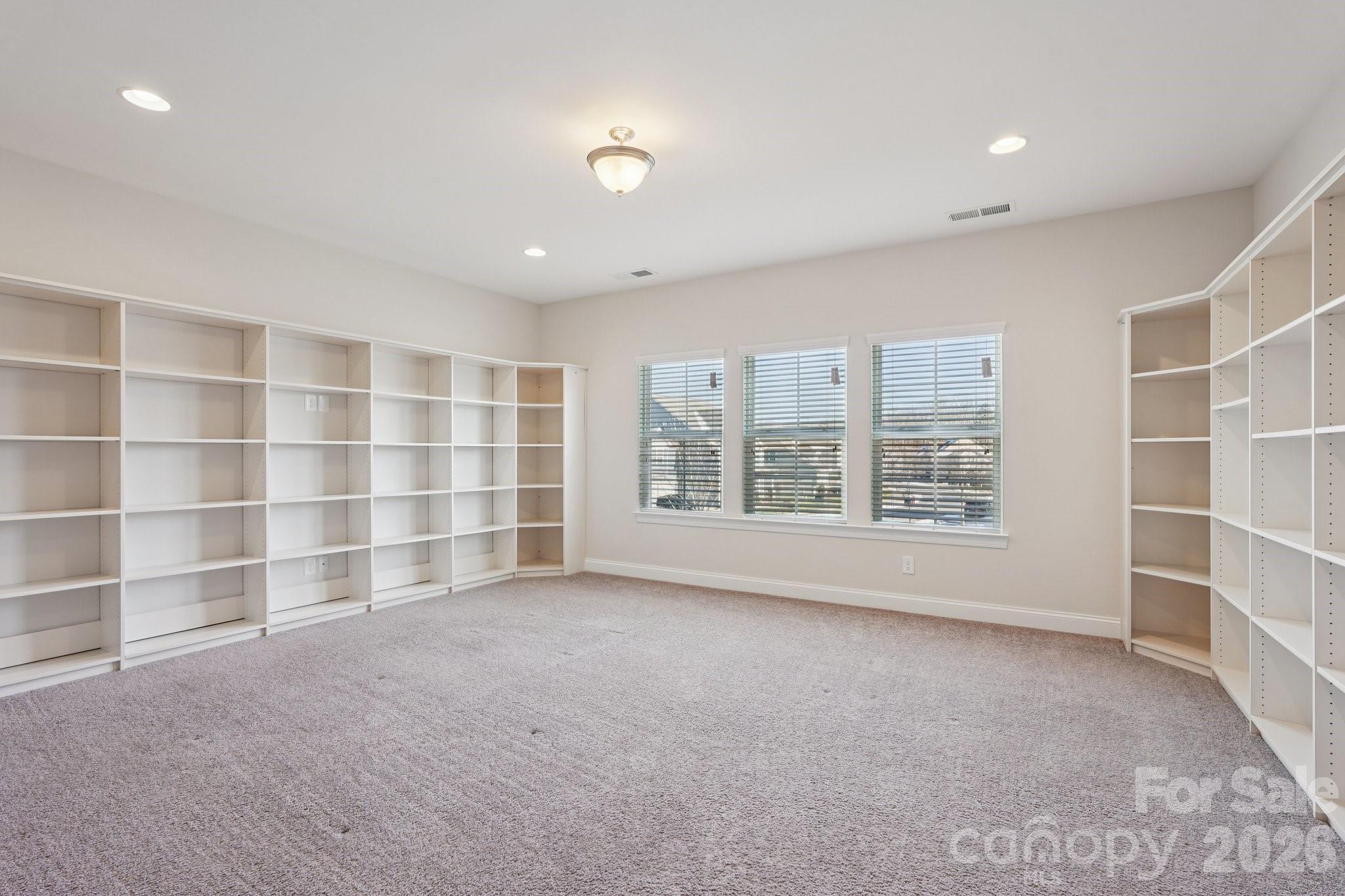17422 Shearer Road Davidson, NC 28036 - Photo 31 of 48 a view of an empty room with a window and closet area