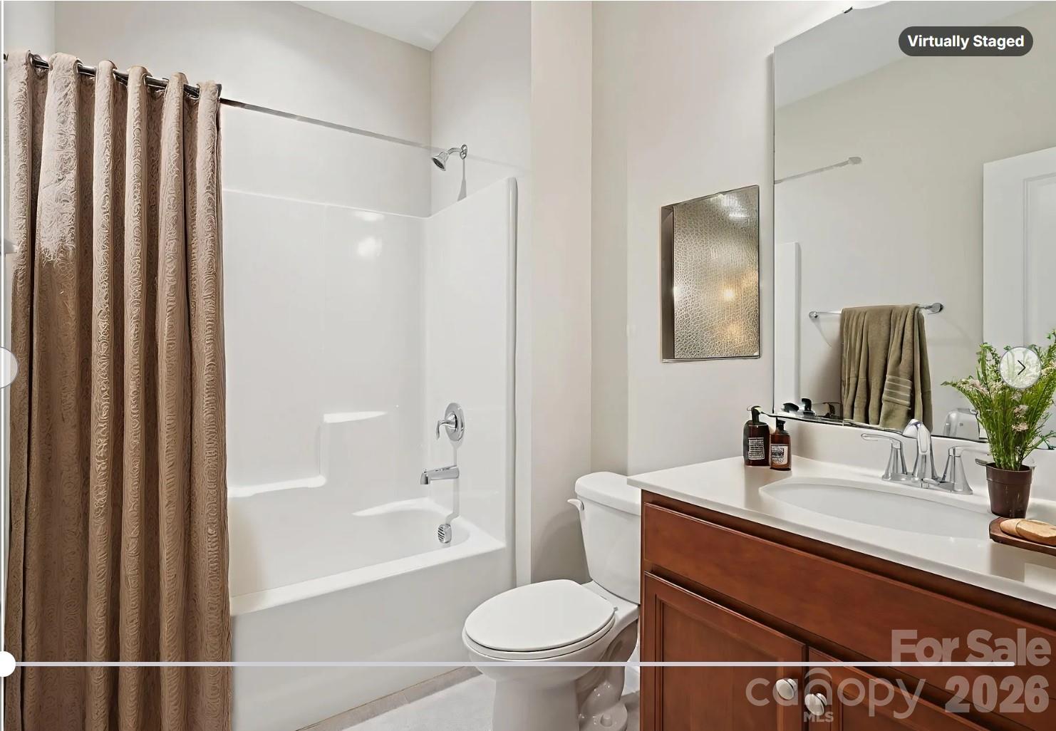 17422 Shearer Road Davidson, NC 28036 - Photo 33 of 48 a bathroom with a sink a toilet a mirror and shower