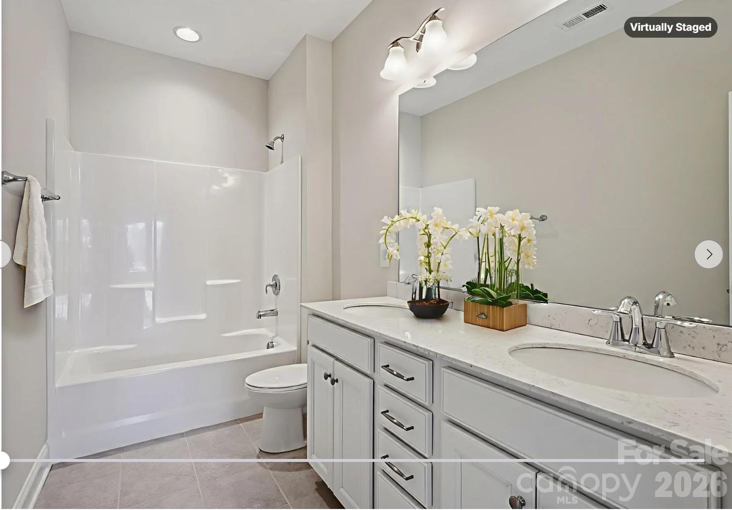 17422 Shearer Road Davidson, NC 28036 - Photo 38 of 48 a bathroom with a granite countertop sink a toilet and bathtub