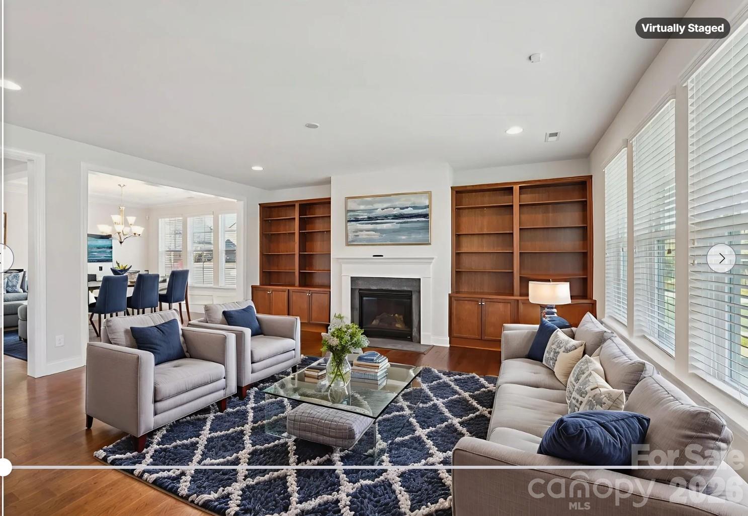 17422 Shearer Road Davidson, NC 28036 - Photo 4 of 48 a living room with furniture a fireplace and a floor to ceiling window