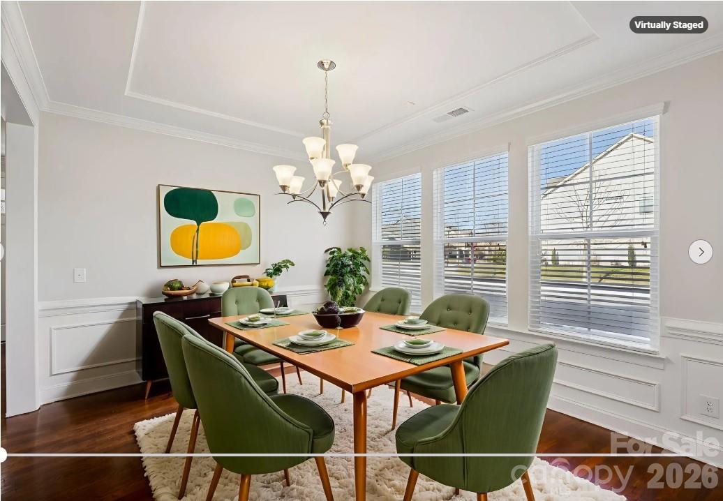 17422 Shearer Road Davidson, NC 28036 - Photo 7 of 48 a dining room with furniture a rug and a chandelier