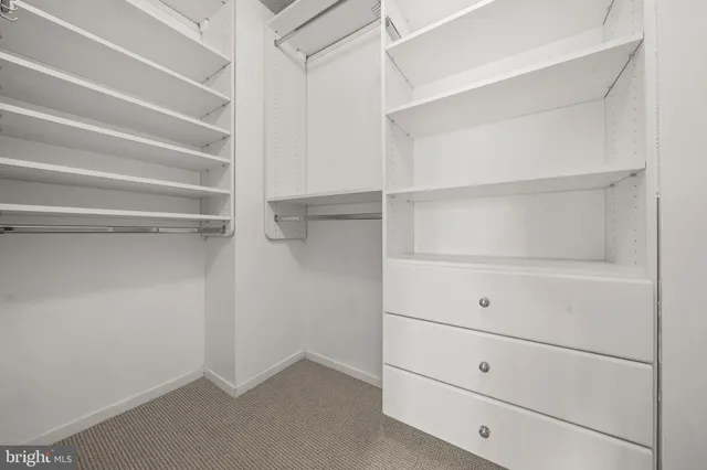 a view of an empty walk in closet