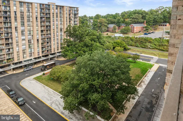 a view of a balcony with yard