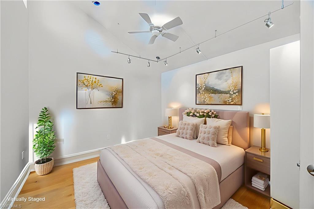 121 Bears Paw Trail Naples, FL 34105 - Photo 20 of 39 a bedroom with a bed and a painting on the wall