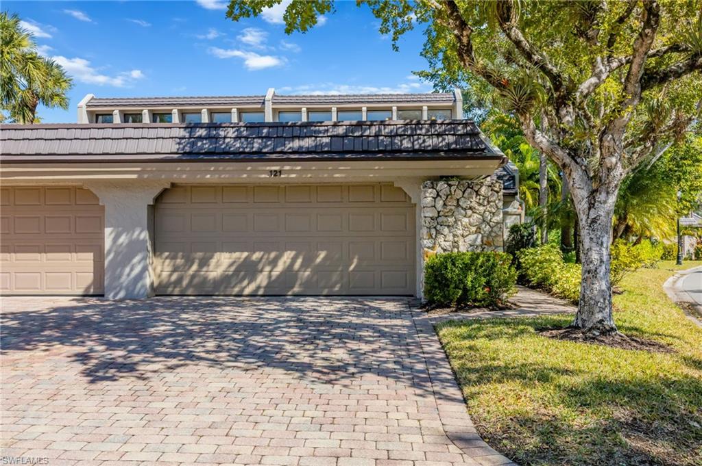 121 Bears Paw Trail Naples, FL 34105 - Photo 28 of 39 a front view of a house with a yard