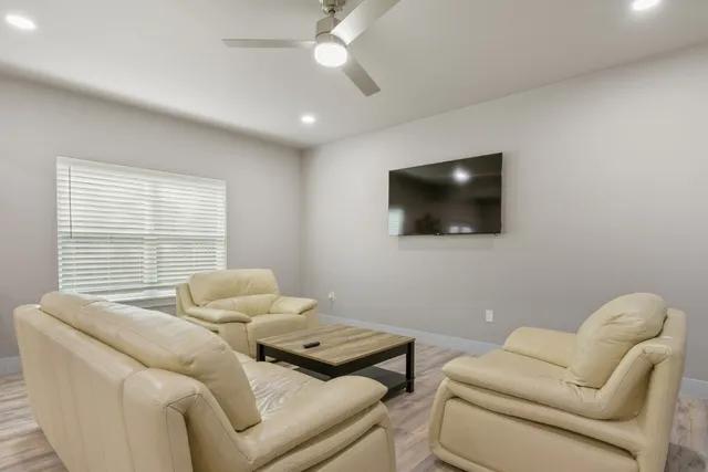 a living room with furniture and a table