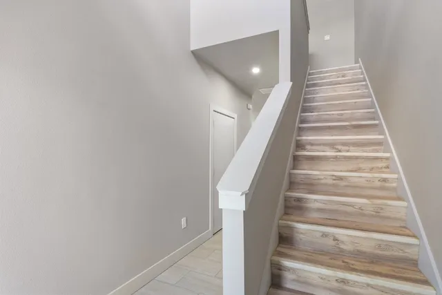 a view of a hallway with a kitchen